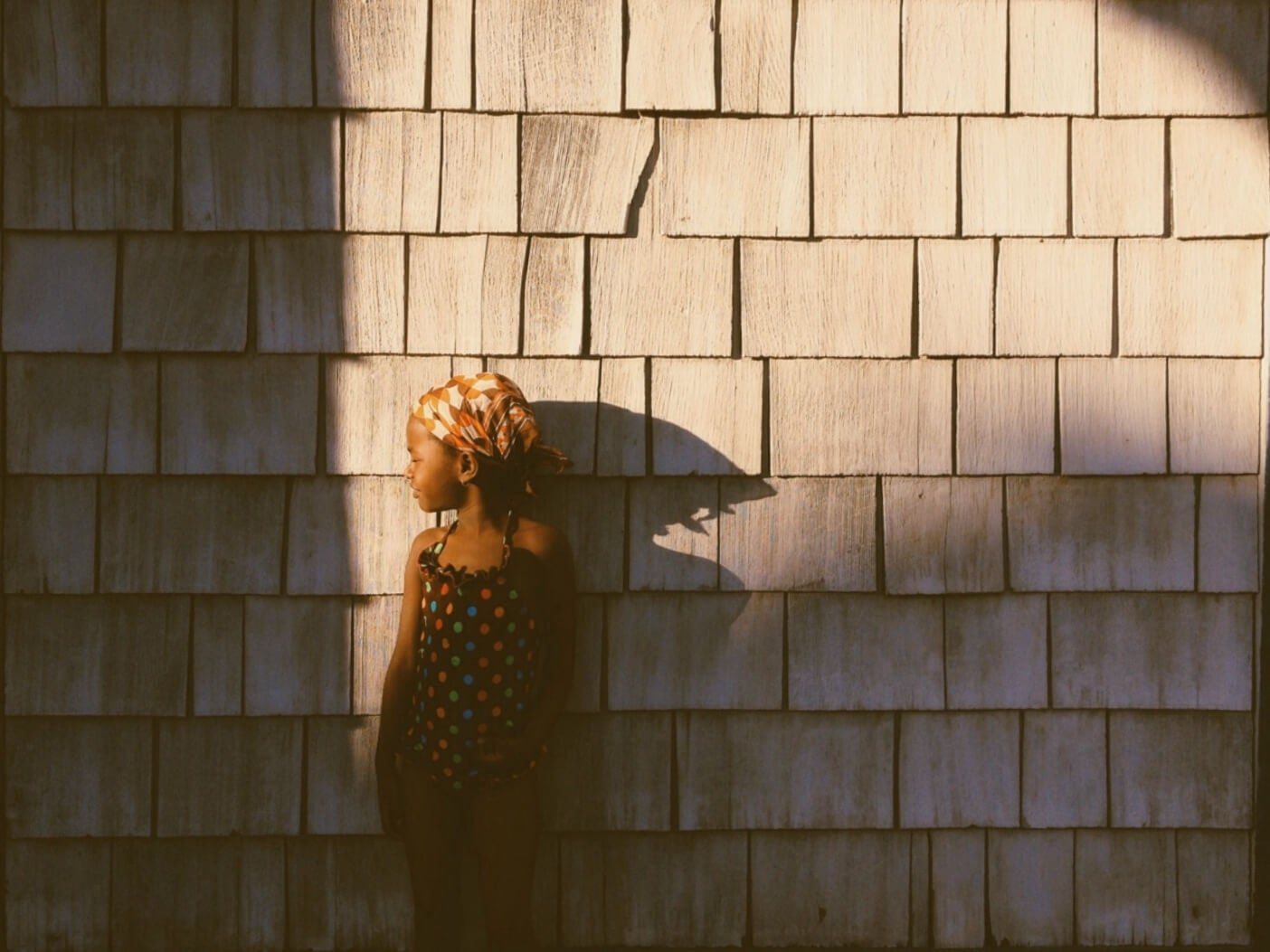 photo of child against textured wall