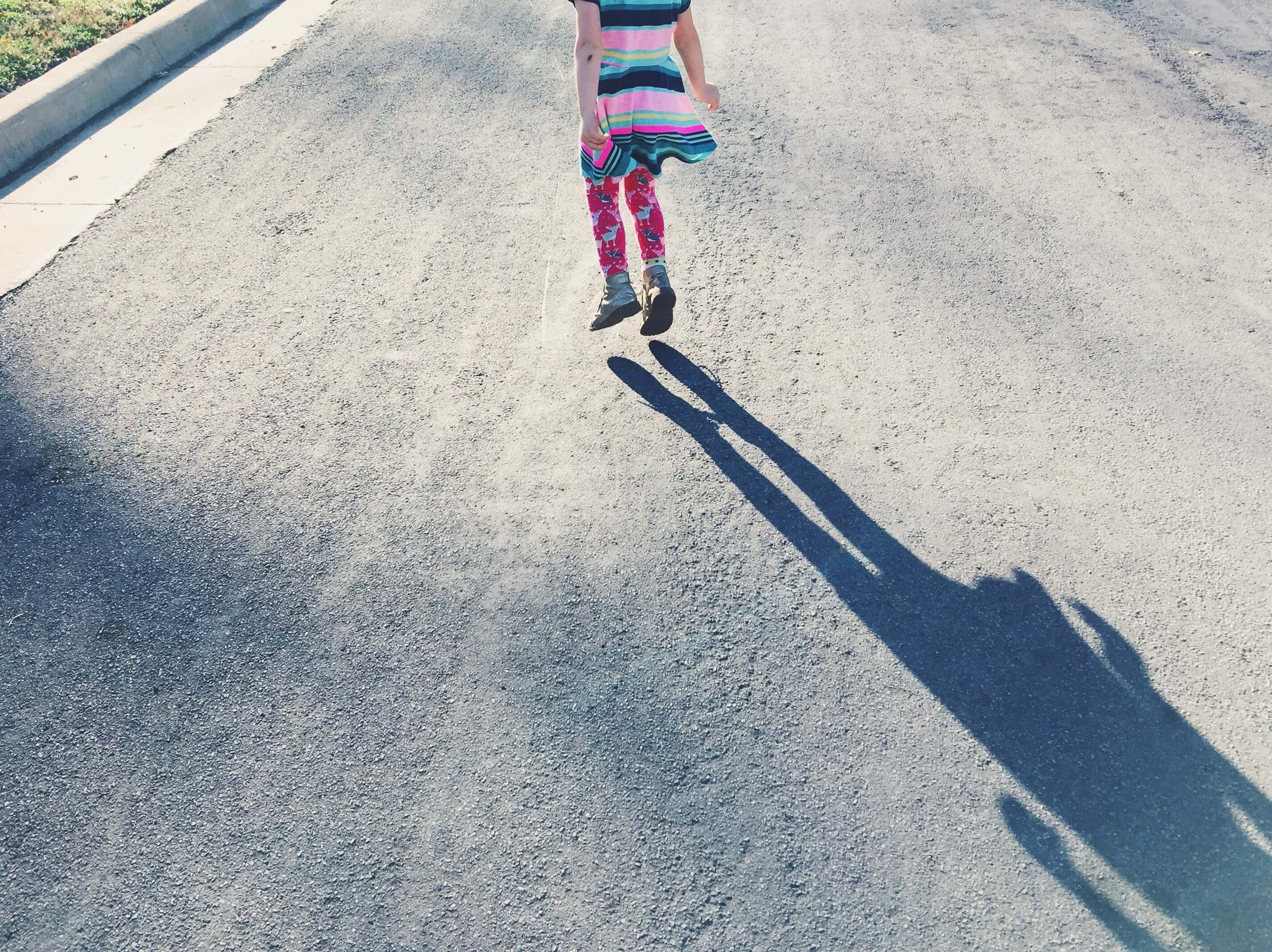 shadow of little girl jumping