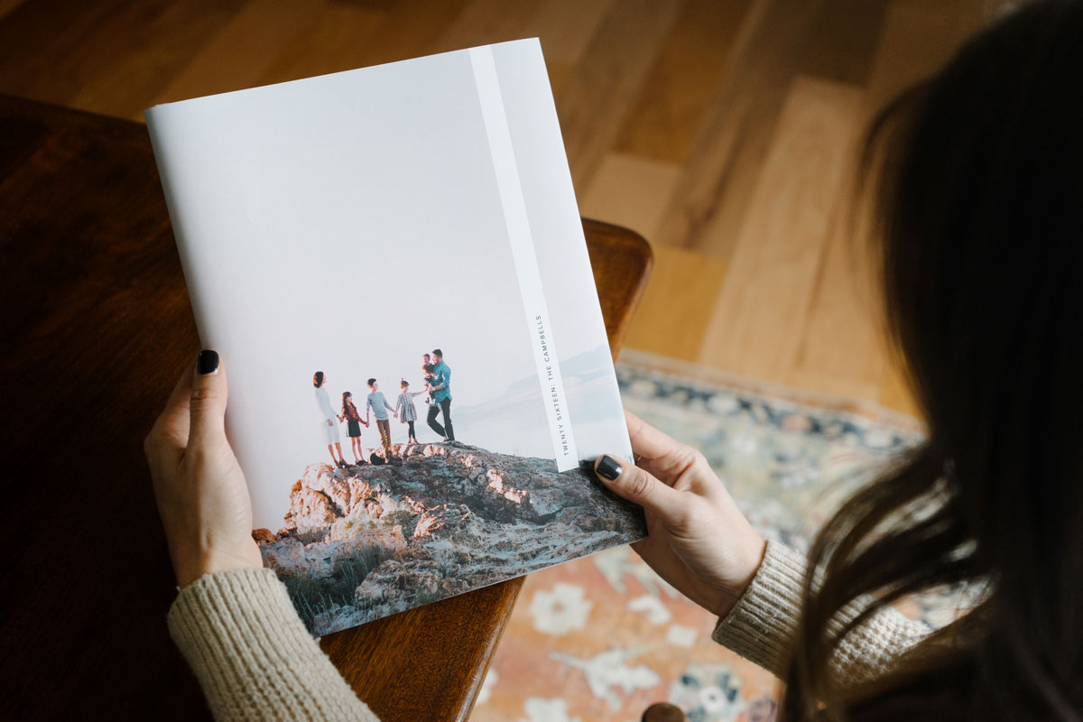 family hiking photo on book cover of year-in-review photo book