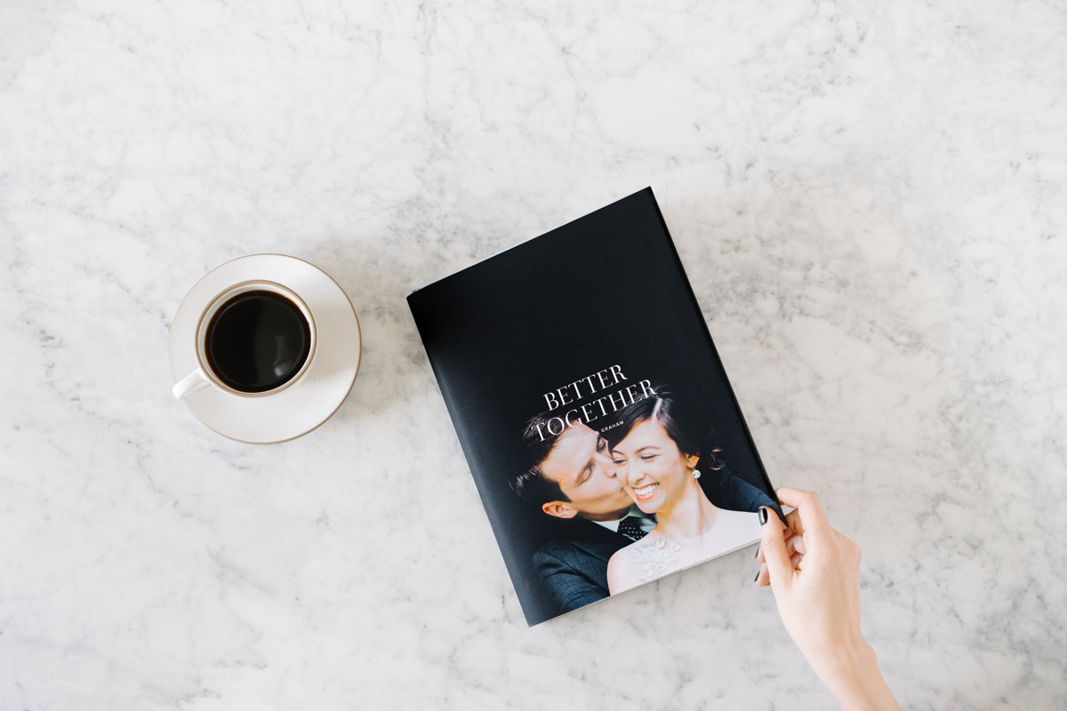 wedding photo book with bride and groom kissing on cover