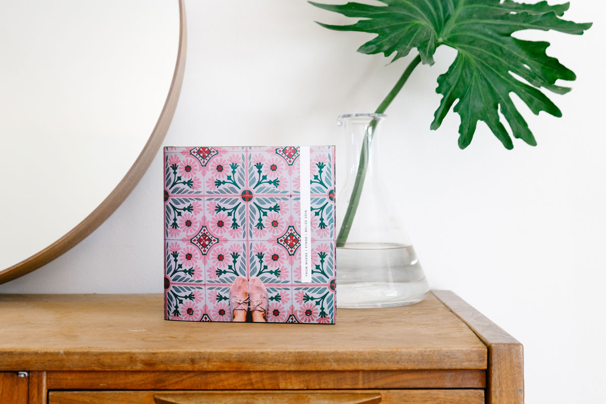 Photo book cover with picture of feet on tile flooring