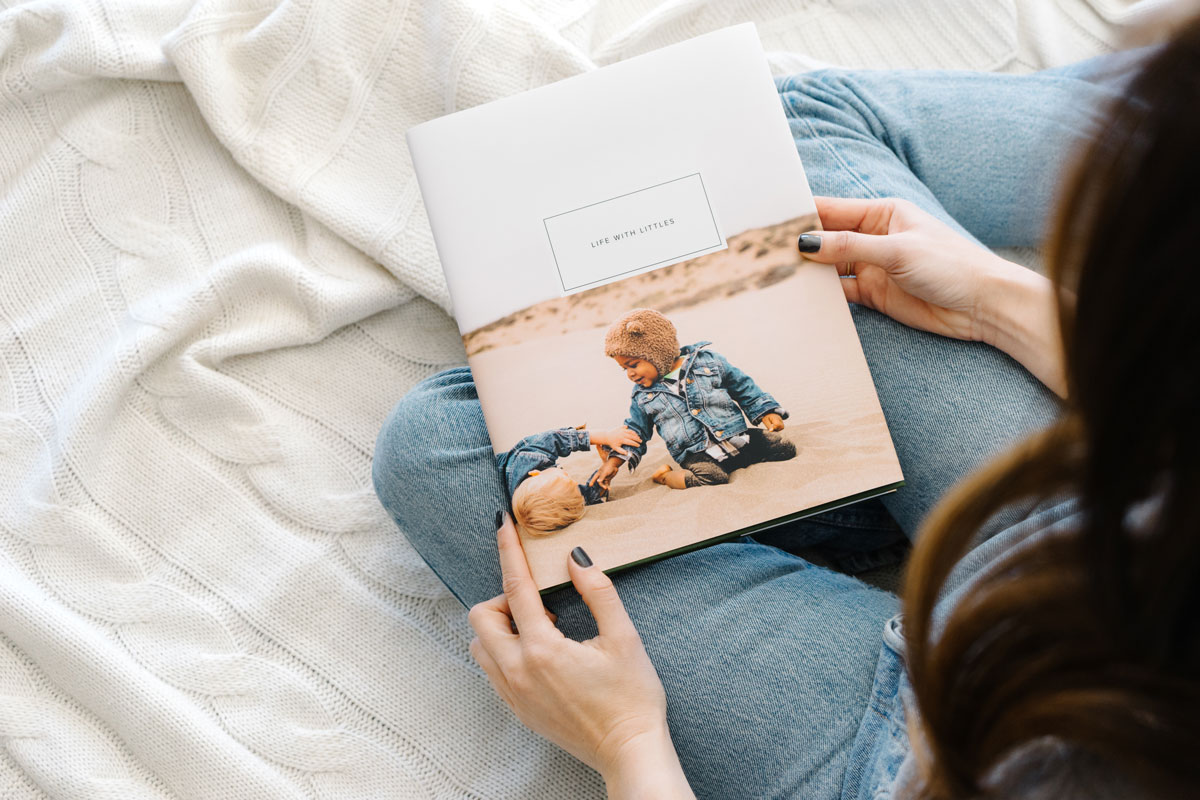 Small children playing in sand on cover of photo book titled Life With Littles