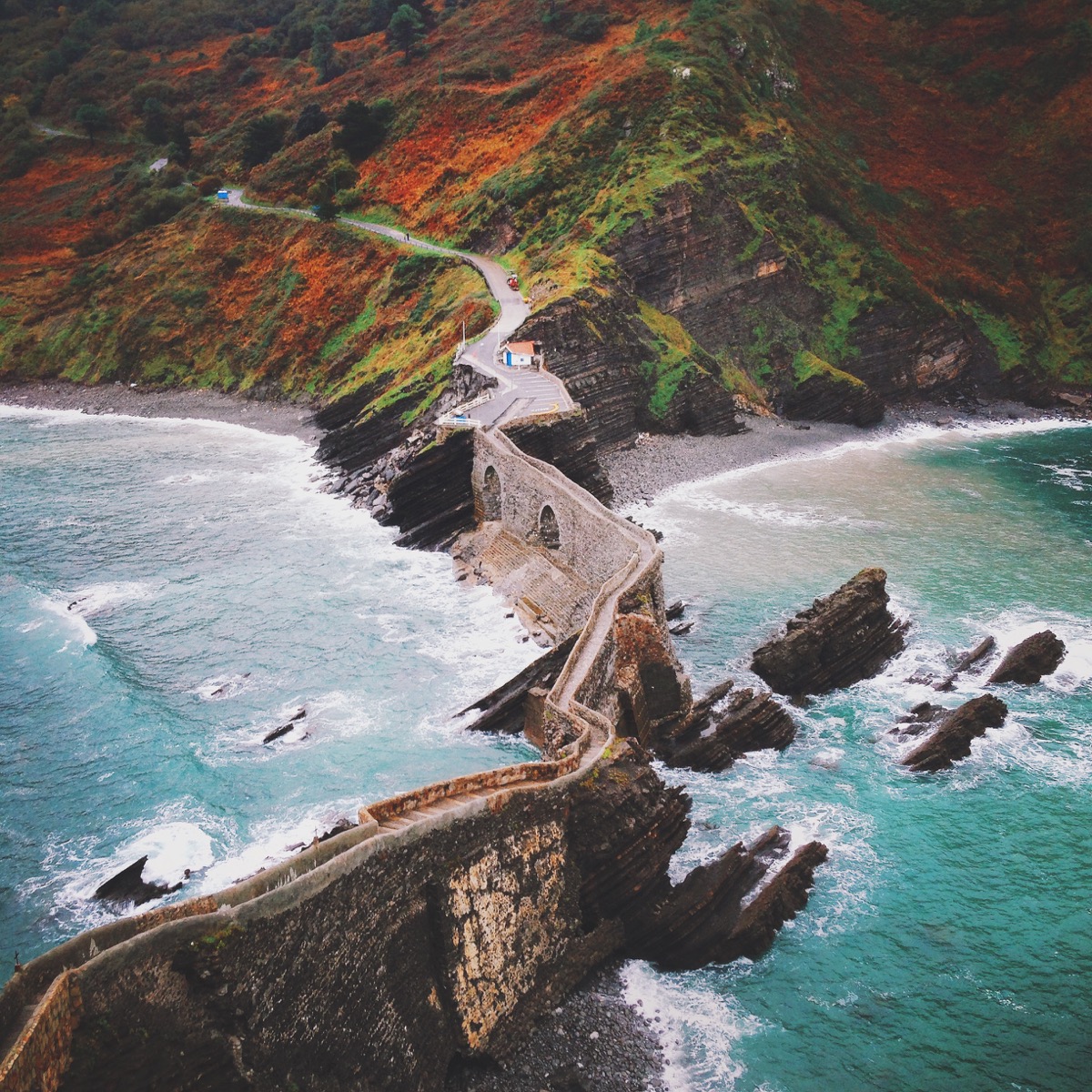 Landscape photo by Alex Strohl of bridge cutting across water