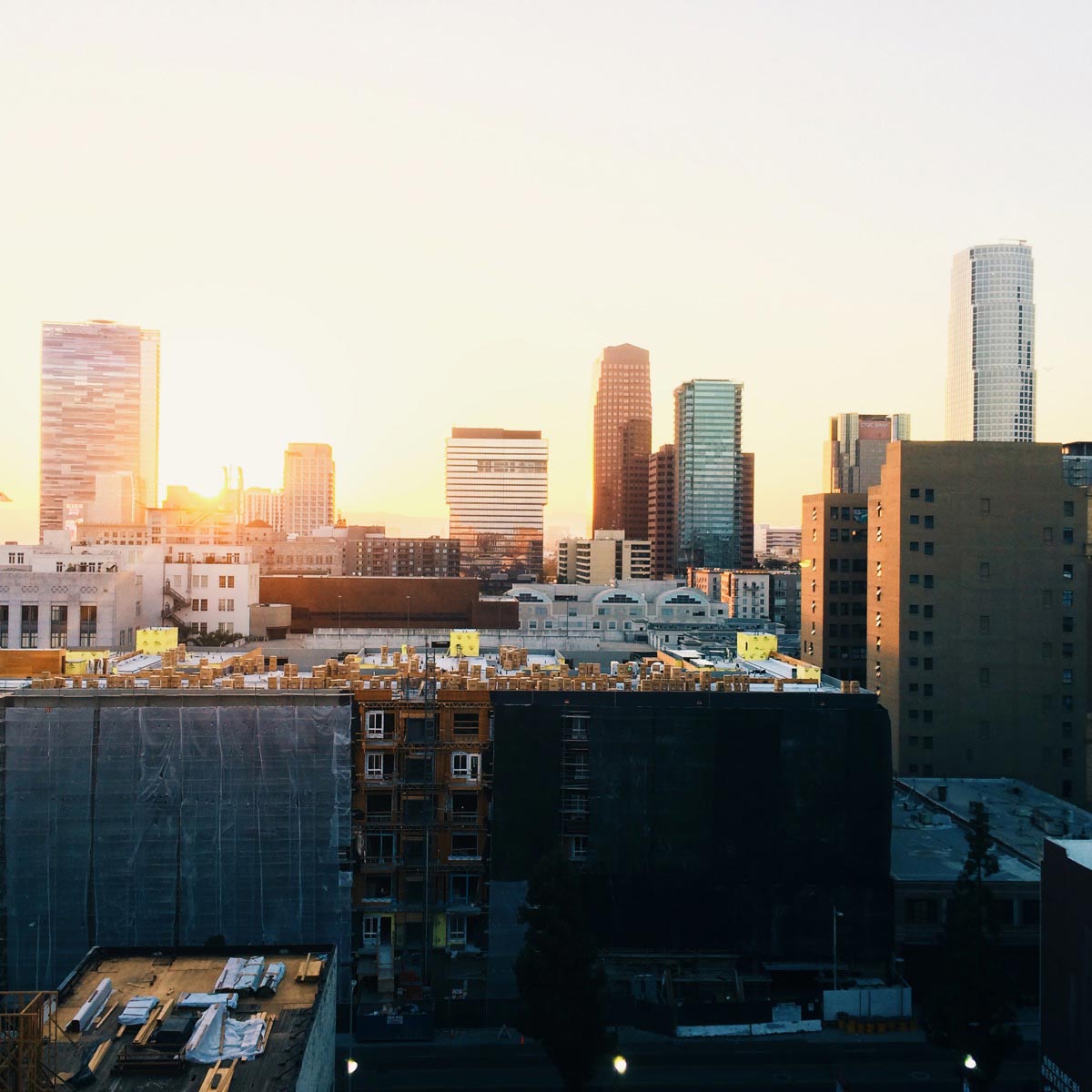 Brenton Clarke photo of sunset behind buildings in the city