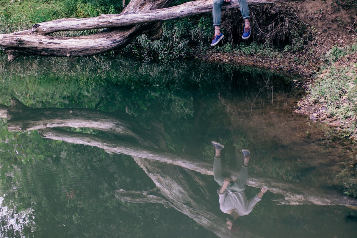 Tim Landis photo of man's reflection in water