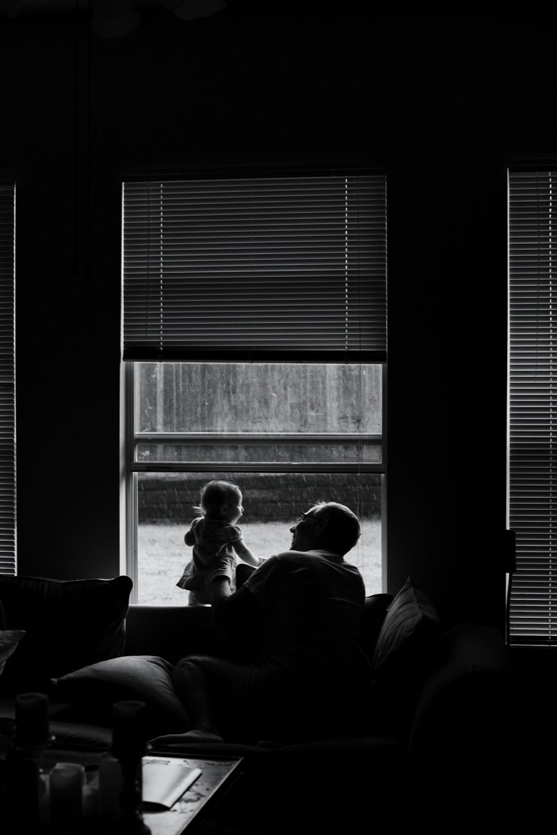 Inkedfingers photo in black and white of man and little girl at window