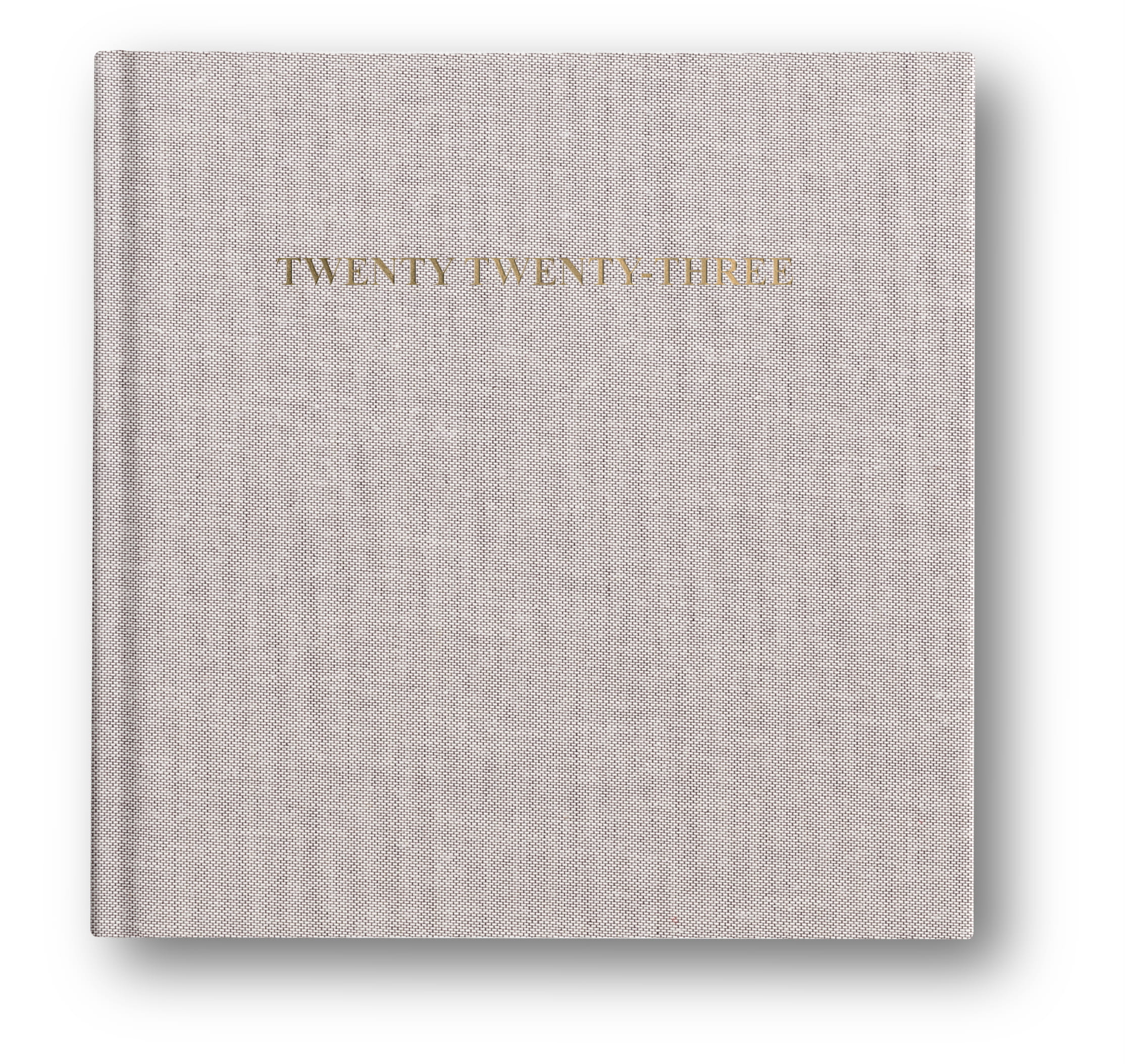 layflat photo album showcasing foil stamped cover text of their 2023 year