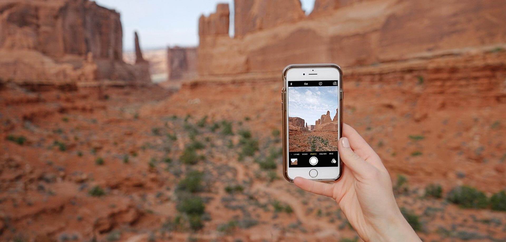 photo of phone using mobile photography tips to take a photo of red rock formations