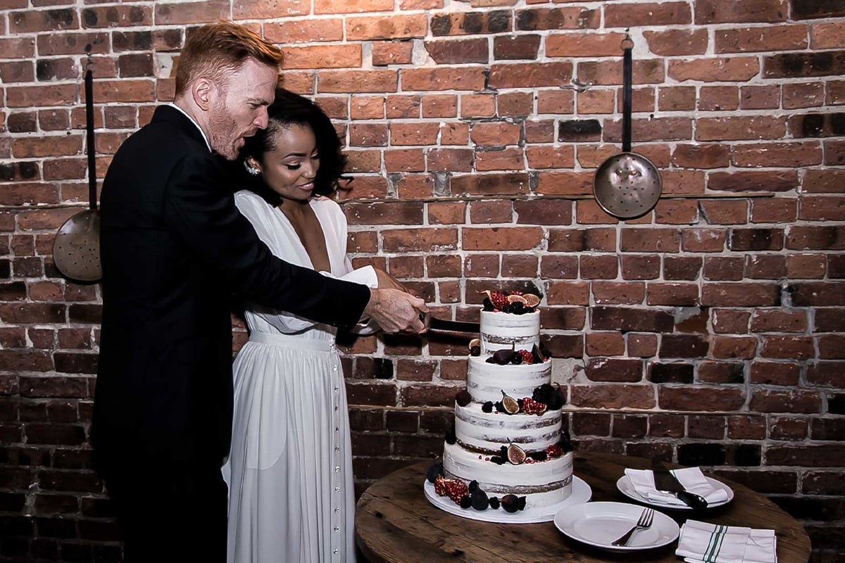 Bride and groom cutting the cake