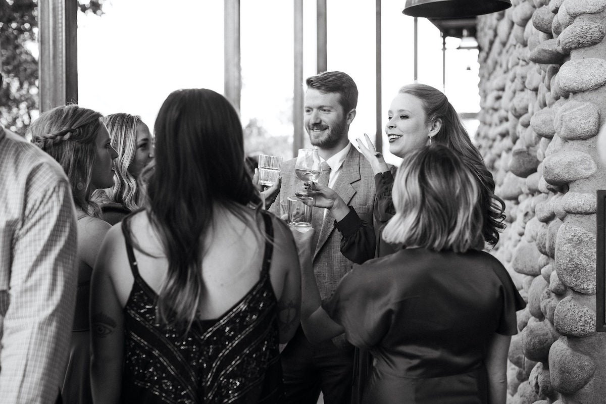 Wedding guests enjoying cocktail hour before the reception