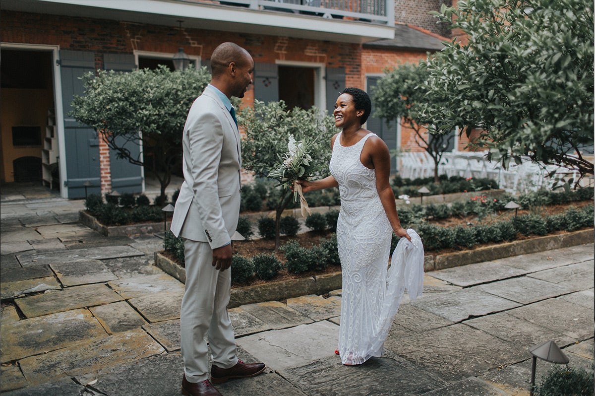 Bride and groom seeing each other for the first time before wedding ceremony