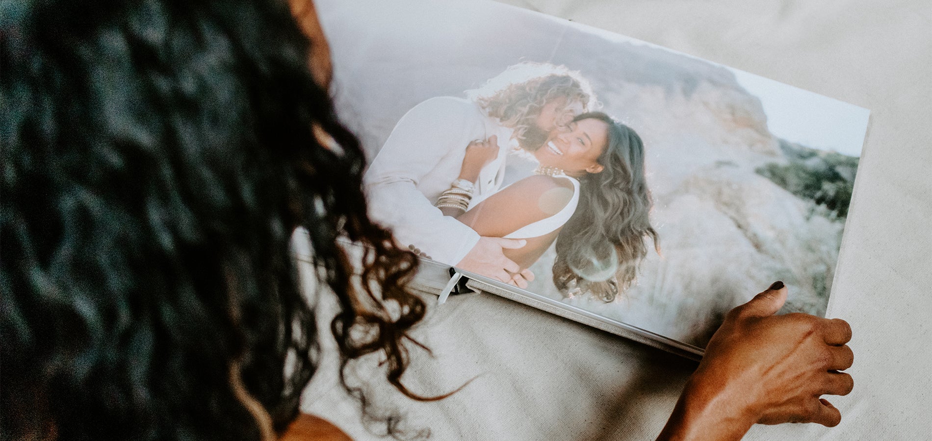 Woman flipping through her wedding album