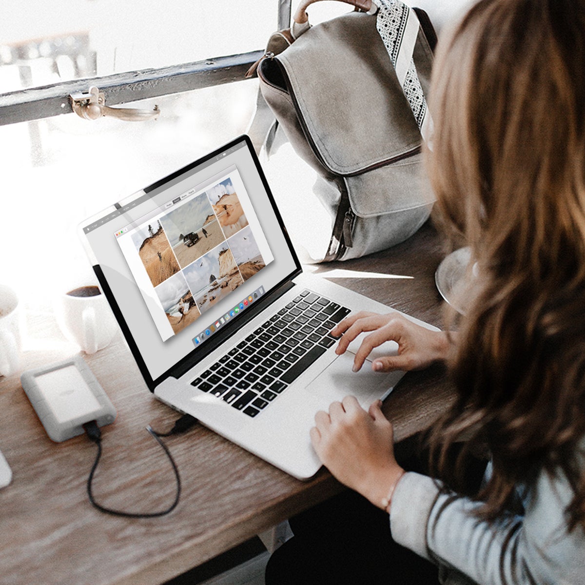 Woman organizing photos on laptop