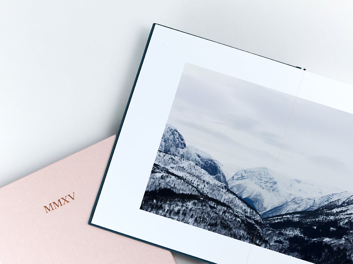 Layflat Photo Book opened to two page image of snowy mountains