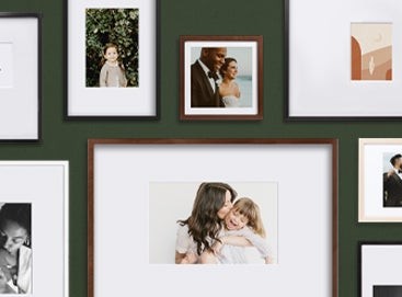 Gallery wall of Artifact Uprising frames featuring a variety of photos and mat sizes