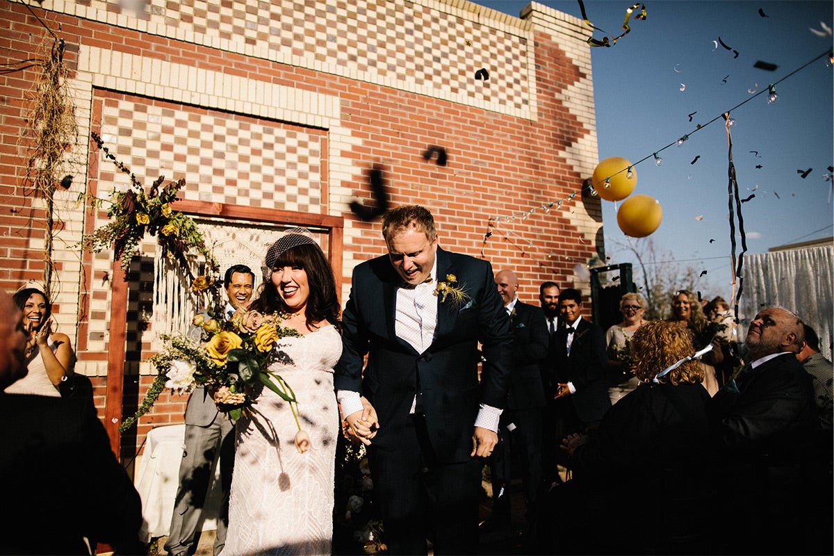 Bride and groom exiting the wedding ceremony as husband and wife