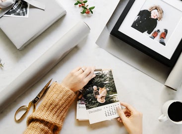 Overhead image of woman wrapping photo calendar