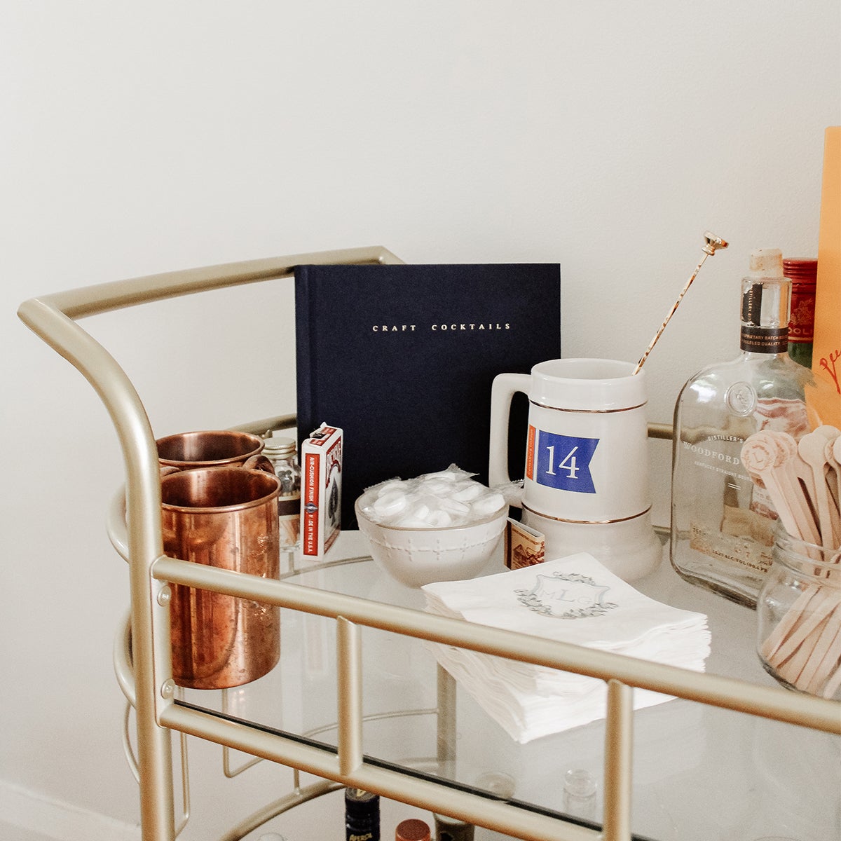 DIY cocktail book on bar cart