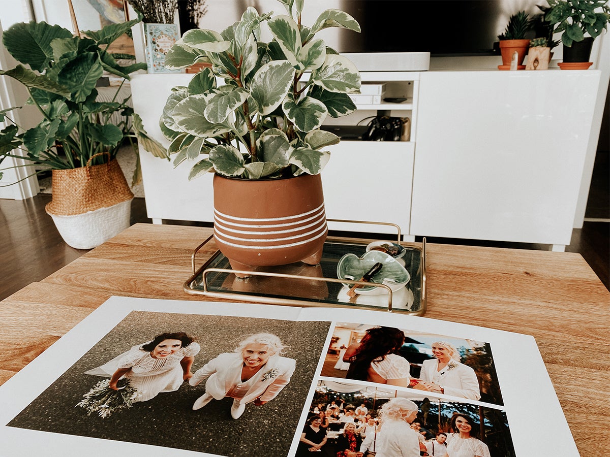 Layflat wedding album open on coffee table