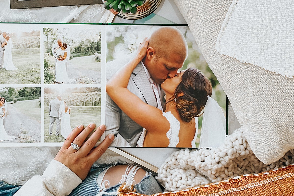 Photo book opened to photos that convey happiness