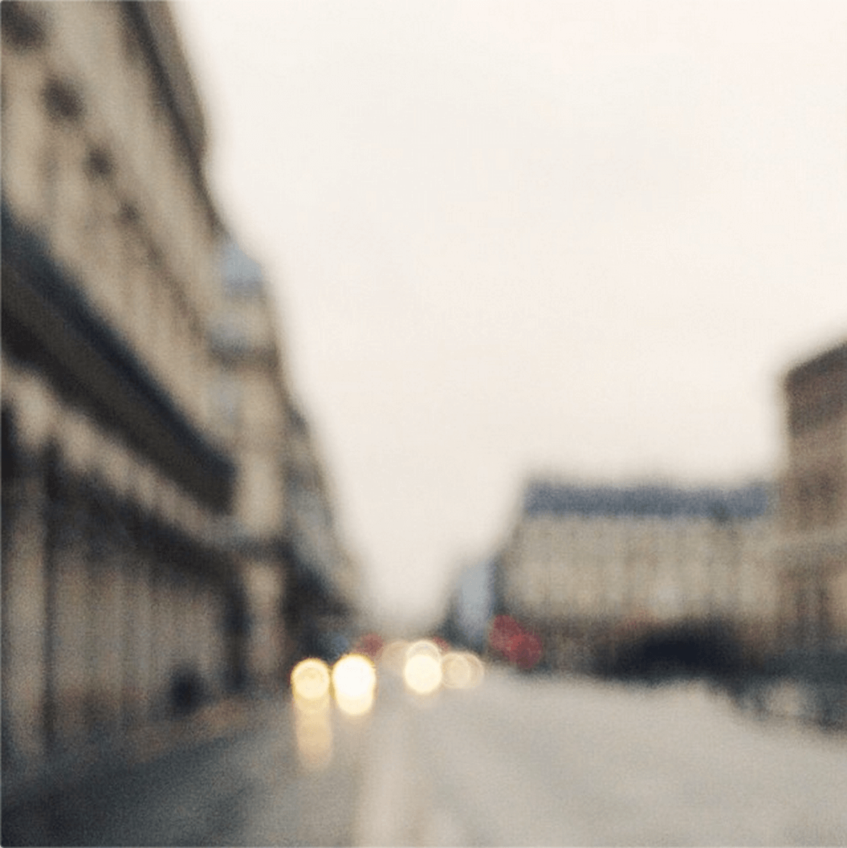 blurred photo of street and car headlights